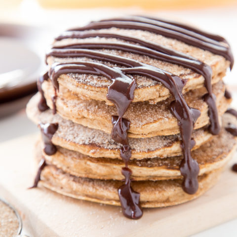 Churro Pancakes With Spicy Chocolate Sauce Cooking On The Front Burner